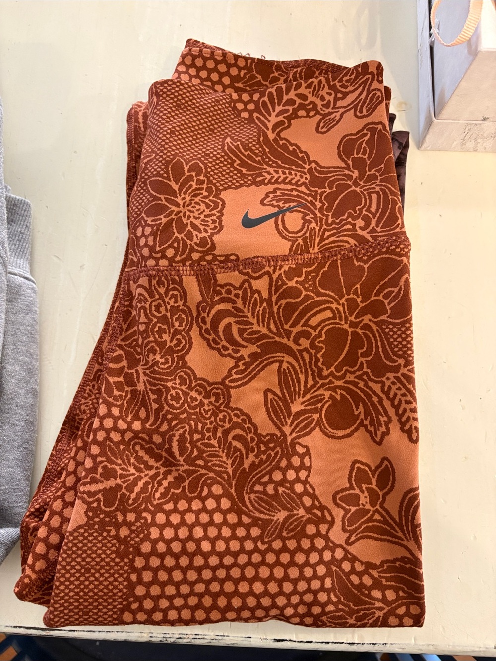 Nike Rust Orange Floral Leggings with Dark Floral Print